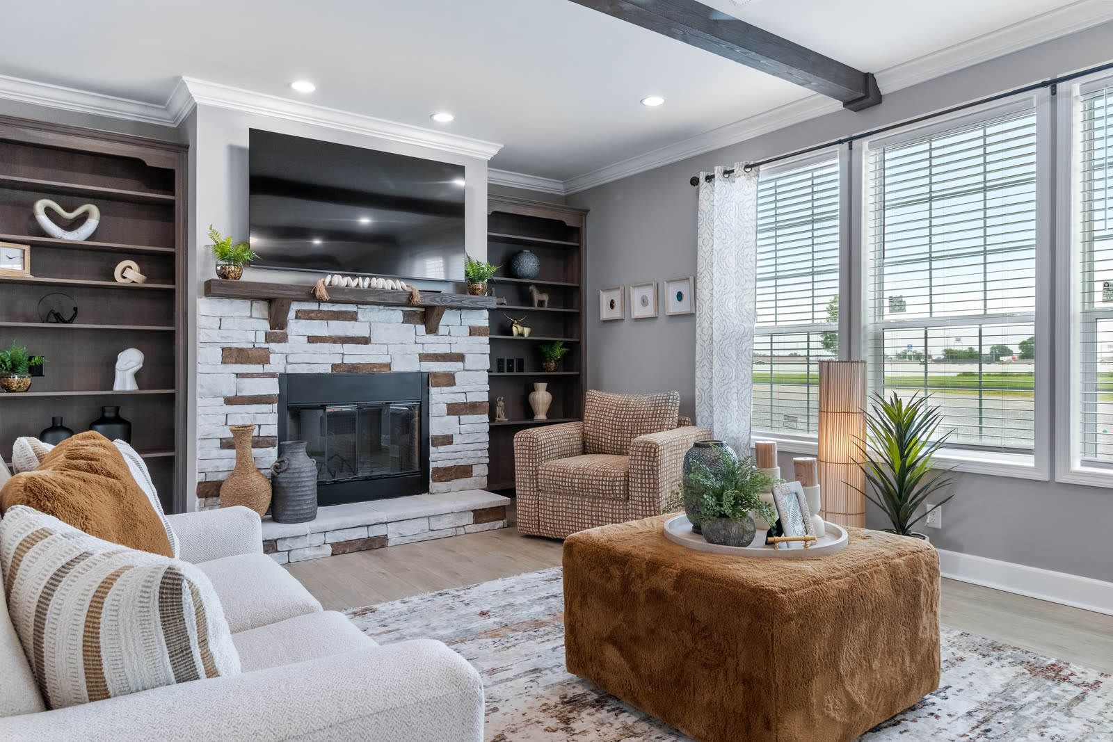 Example HDR interior: living room with a stone fireplace and bright windows