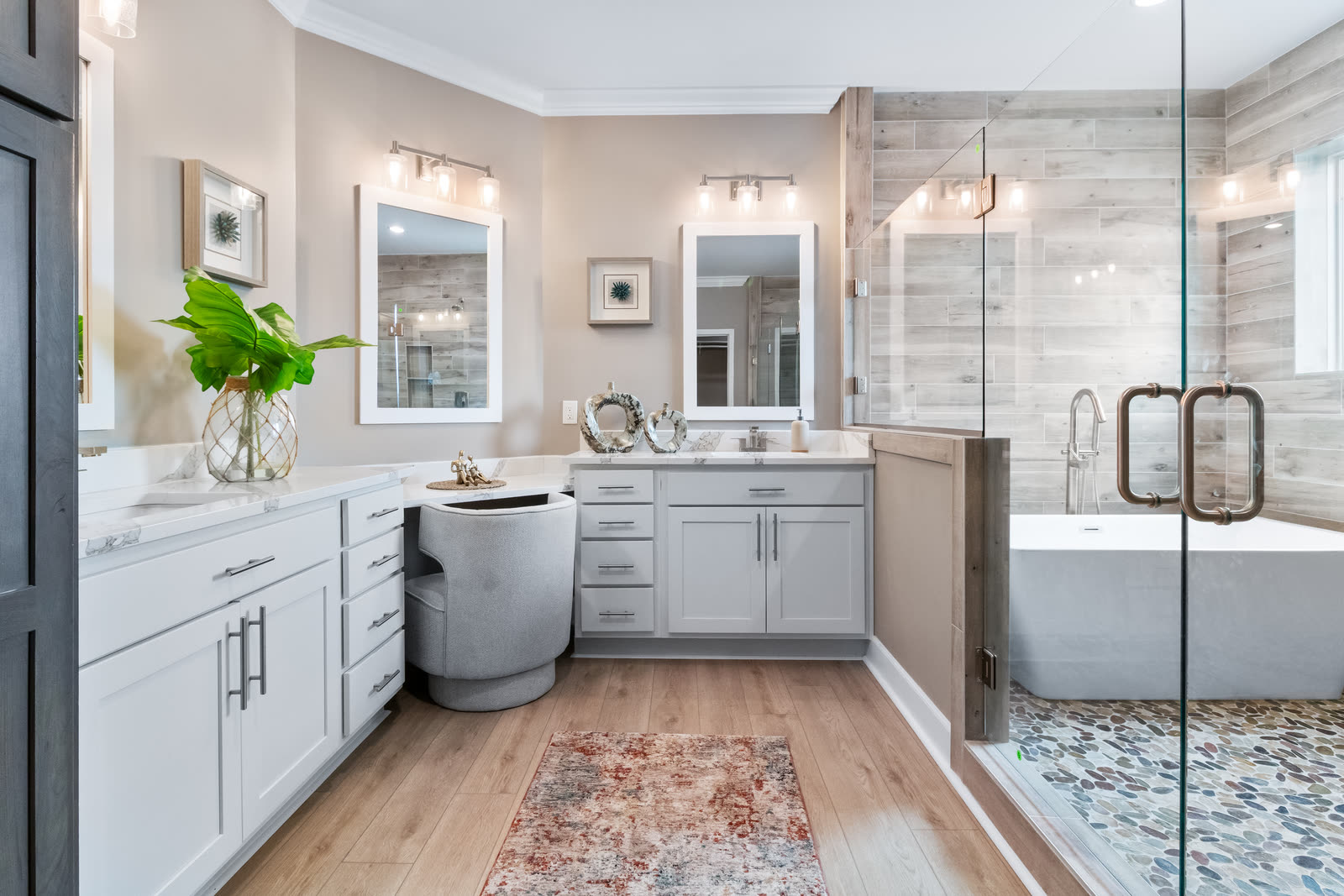 Primary bath with a soaking tub, glass shower and double vanity